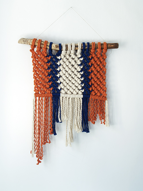 trois couleurs tapestry, full view of tapestry inspired by marine decoration orange, blue and natural cotton ropes with wooden branch support