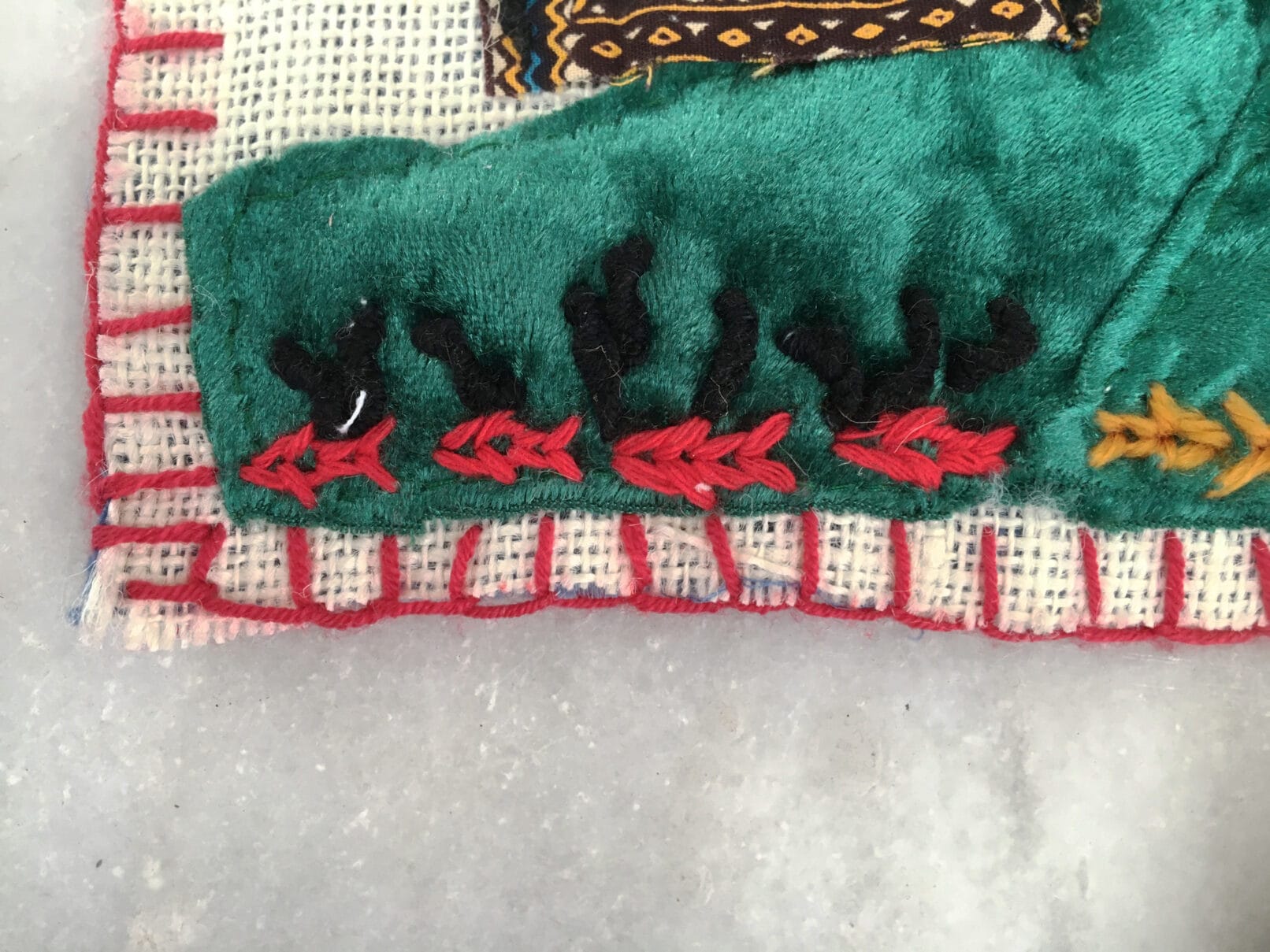 Picasso masterpiece Guernica. Arpillera EL Duelo is a textile art work of small format and great visual impact.