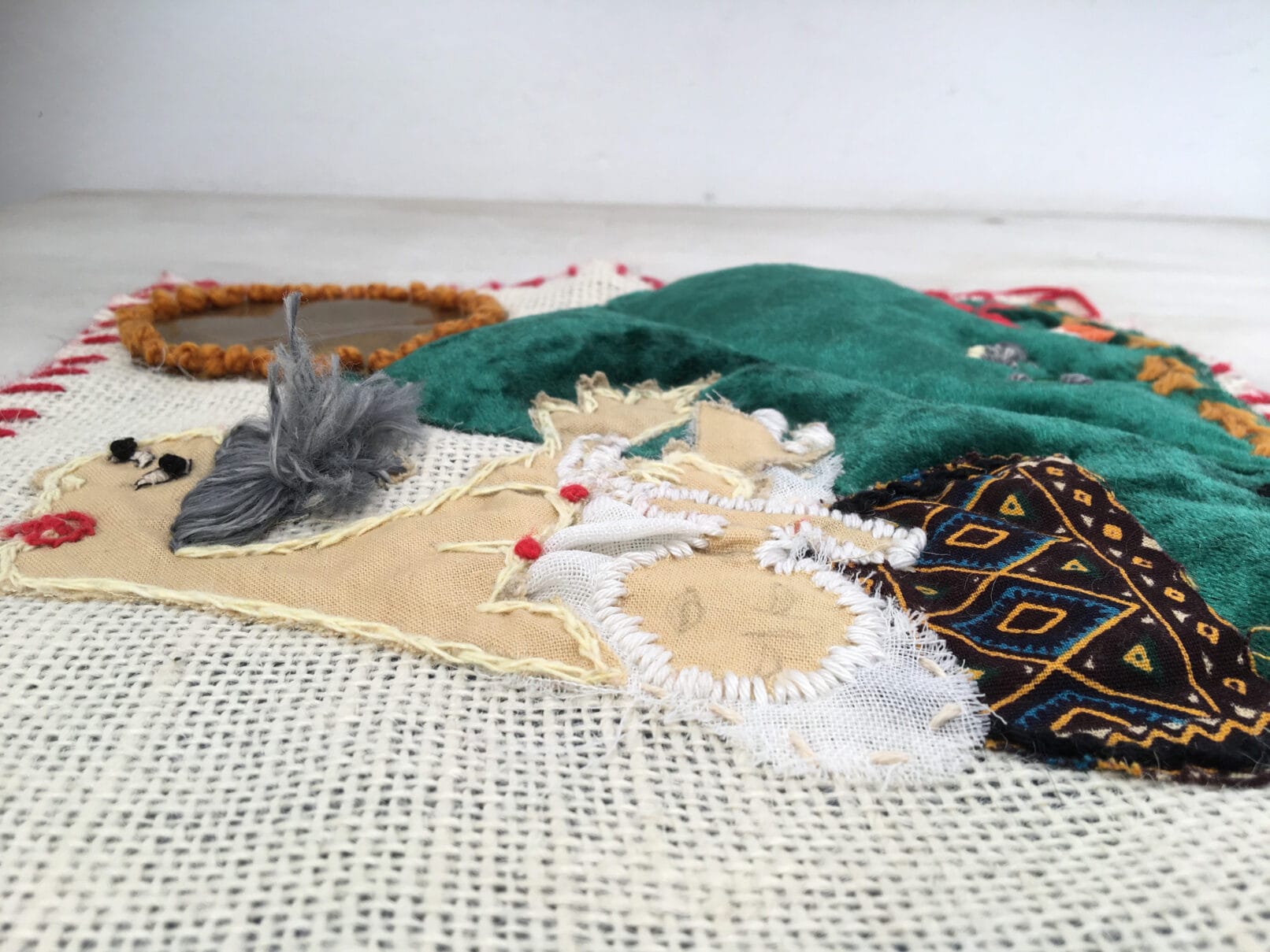 Picasso masterpiece Guernica. Arpillera EL Duelo is a textile art work of small format and great visual impact.